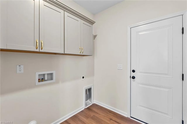 laundry room featuring washer hookup, electric dryer hookup, cabinets, and wood-type flooring