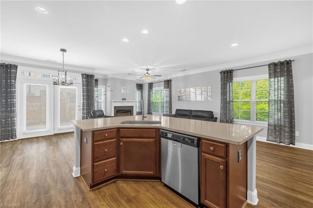 1604 Sunny Hill Way, Colfax, NC 27235 - kitchen with stainless steel dishwasher, a sink, open floor plan, crown molding, and light countertops