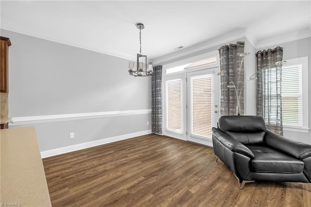 1604 Sunny Hill Way, Colfax, NC 27235 - living area featuring a chandelier, crown molding, wood finished floors, and baseboards