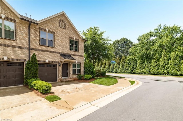 1604 Sunny Hill Way, Colfax, NC 27235 - view of front of property featuring brick siding, driveway, and an attached garage