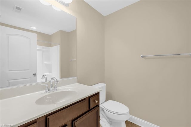 1604 Sunny Hill Way, Colfax, NC 27235 - full bathroom featuring toilet, vanity, a shower, and baseboards