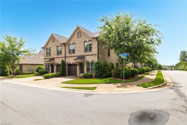 1604 Sunny Hill Way, Colfax, NC 27235 - view of front of property with driveway, brick siding, and an attached garage