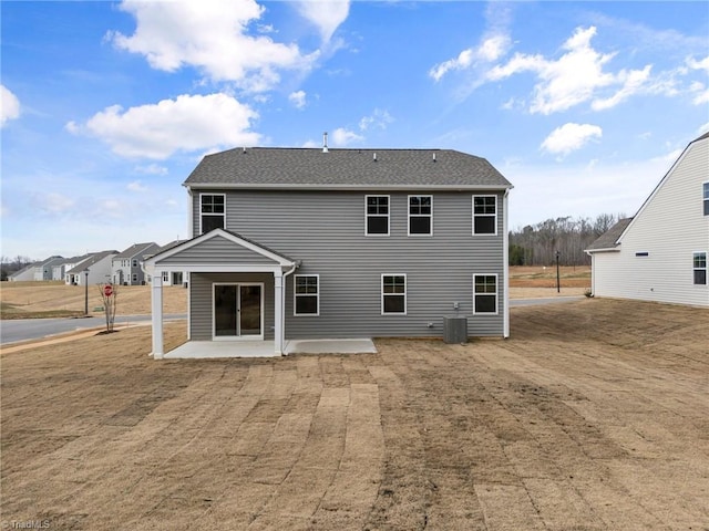 back of house featuring cooling unit and a patio