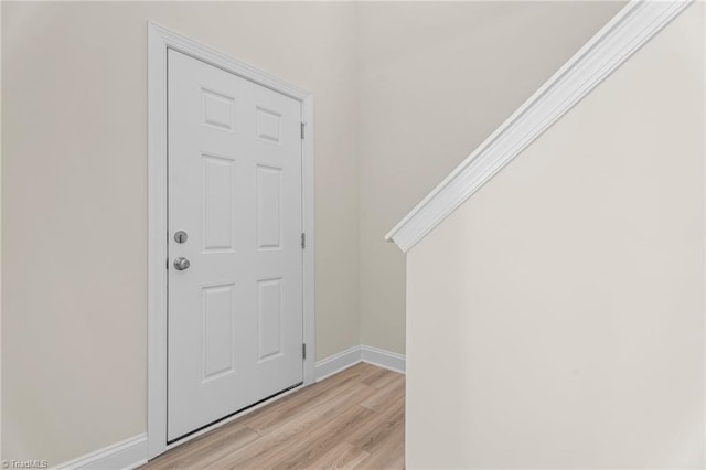 foyer entrance with light wood-type flooring