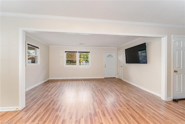 interior space with ornamental molding and light hardwood / wood-style floors