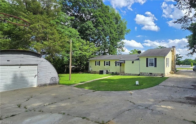 3613 Mcconnell Rd, Greensboro, NC 27405 - view of front of property with an outbuilding, driveway, a front yard, a garage, and a chimney