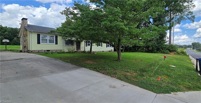 3613 Mcconnell Rd, Greensboro, NC 27405 - view of front of house with crawl space, a chimney, and a front lawn