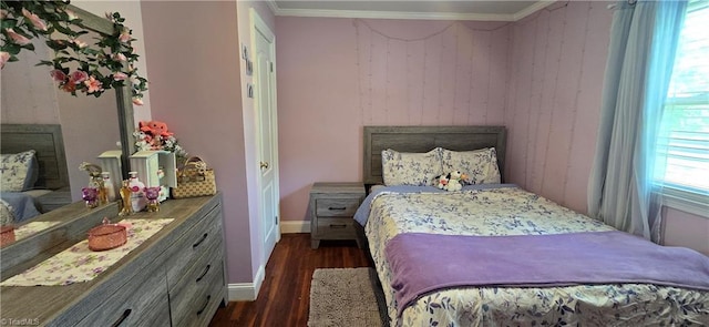 3613 Mcconnell Rd, Greensboro, NC 27405 - bedroom with dark wood finished floors, crown molding, and wood walls