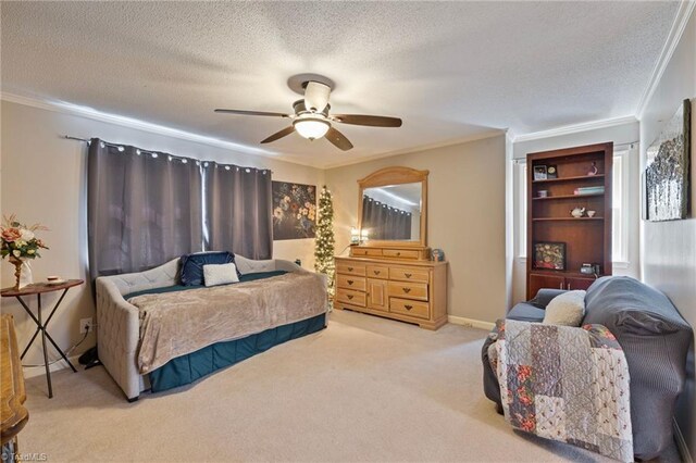 carpeted bedroom featuring a textured ceiling, ornamental molding, and ceiling fan