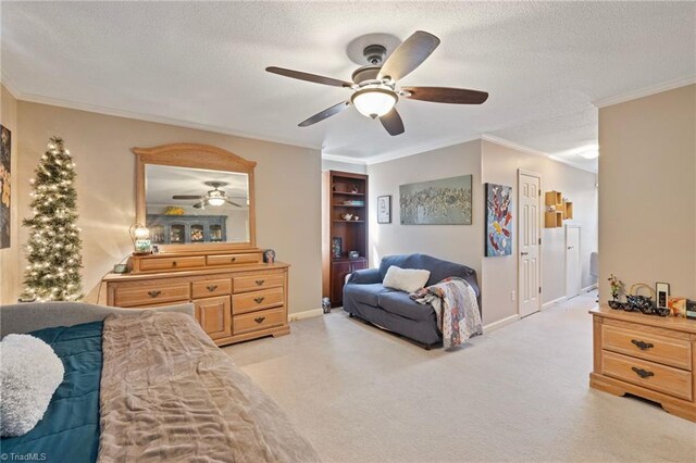 bedroom featuring a textured ceiling, light colored carpet, ornamental molding, and ceiling fan