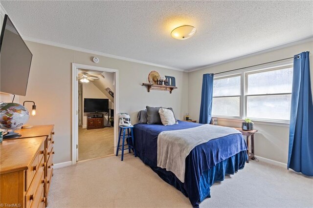 bedroom featuring crown molding, baseboards, a textured ceiling, and light colored carpet