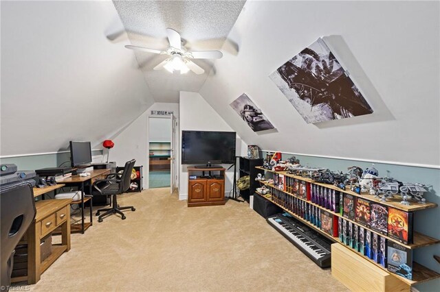 office space with light colored carpet, a ceiling fan, and lofted ceiling