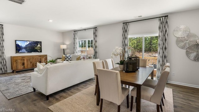 dining space featuring dark hardwood / wood-style floors and a wealth of natural light