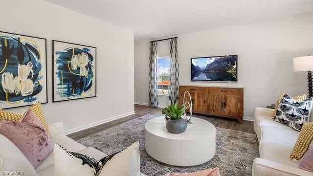 living room with dark hardwood / wood-style floors