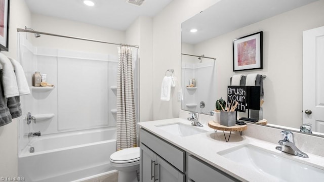 full bathroom featuring vanity, toilet, and shower / tub combo