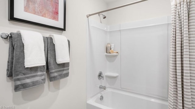 bathroom featuring shower / bathtub combination with curtain