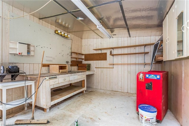 4642 Kings Gate Dr, Winston-Salem, NC 27101 - misc room featuring a workshop area, wood walls, and unfinished concrete floors