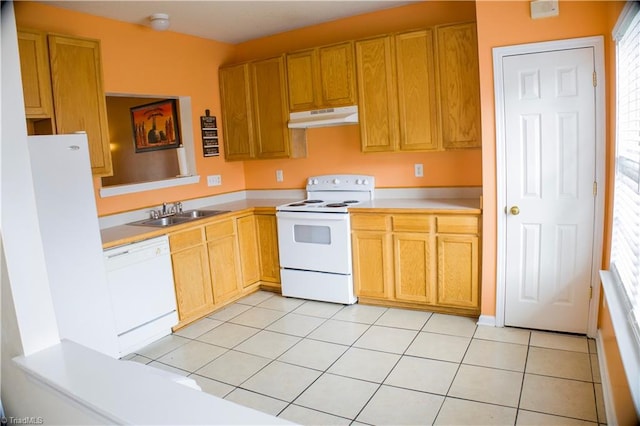 kitchen with light tile patterned floors, white appliances, sink, and a wealth of natural light