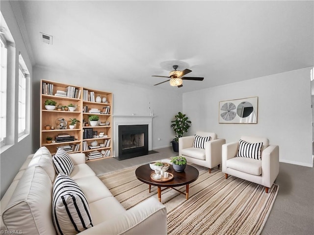 living room featuring light carpet and ceiling fan