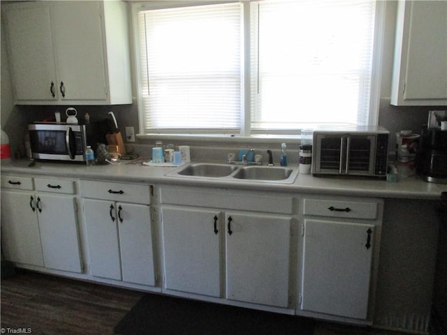 500 Avalon Pl, High Point, NC 27262 - kitchen with stainless steel microwave, white cabinets, and light countertops