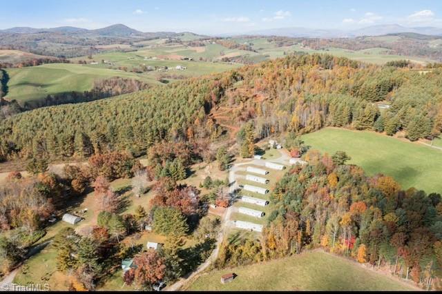 drone / aerial view featuring a mountain view