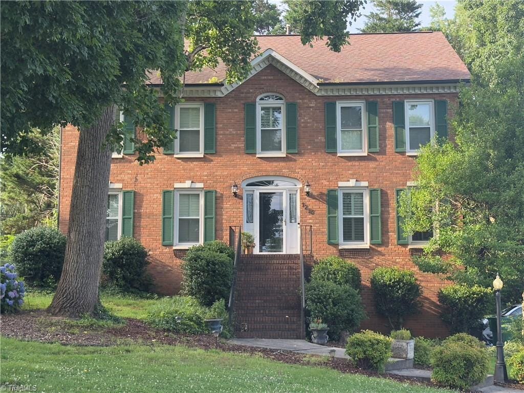 1213 Elmwood Ave, High Point, NC 27265 - view of front of property with brick siding and a shingled roof