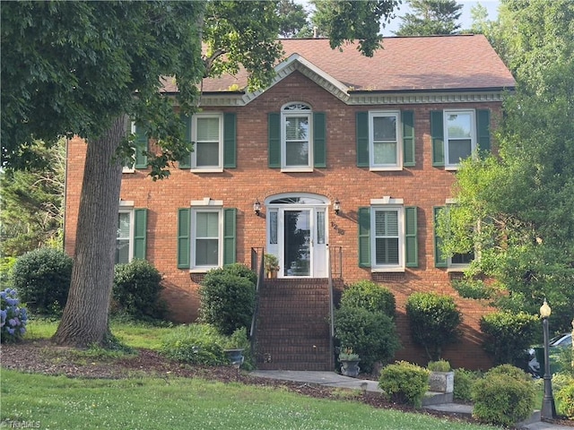 1213 Elmwood Ave, High Point, NC 27265 - view of front of property with brick siding and a shingled roof