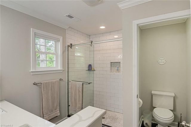bathroom featuring a stall shower, toilet, and visible vents