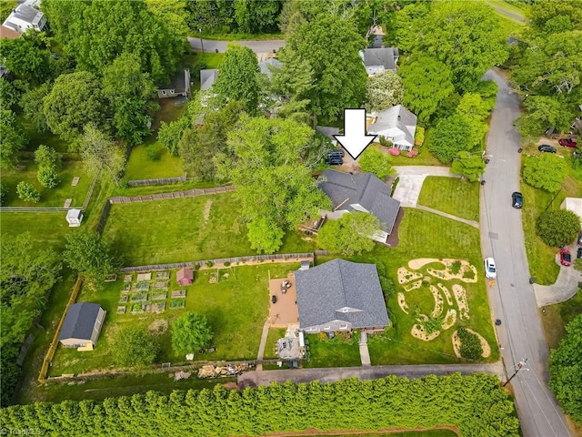 birds eye view of property with a residential view