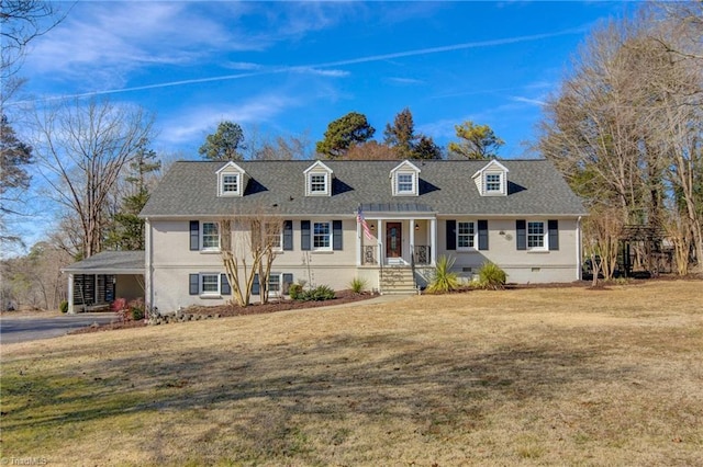 cape cod home featuring a carport and a front lawn