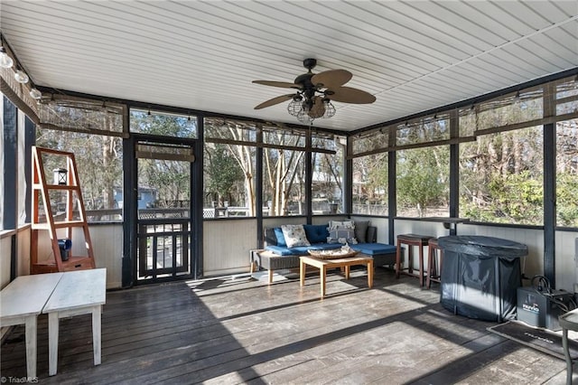 sunroom featuring ceiling fan