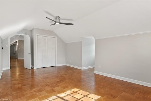 additional living space with lofted ceiling and ceiling fan