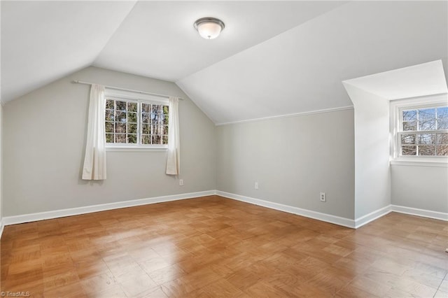 bonus room with plenty of natural light and lofted ceiling