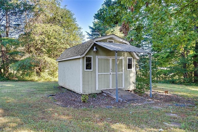 view of outdoor structure with a lawn