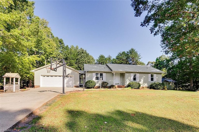 ranch-style house featuring a garage and a front lawn