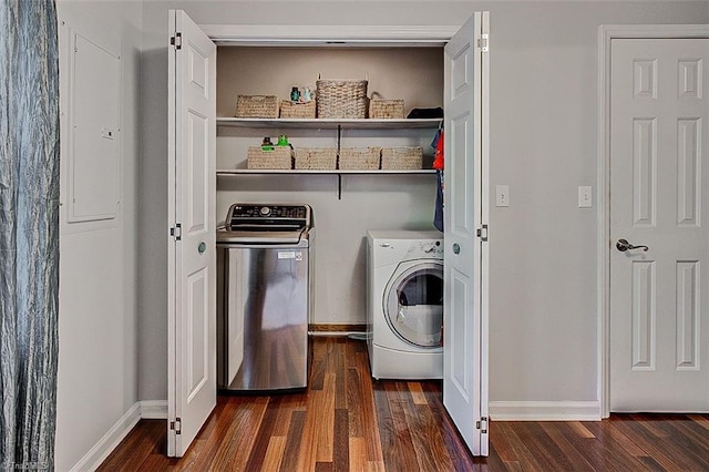 laundry room featuring electric panel, dark hardwood / wood-style floors, and independent washer and dryer