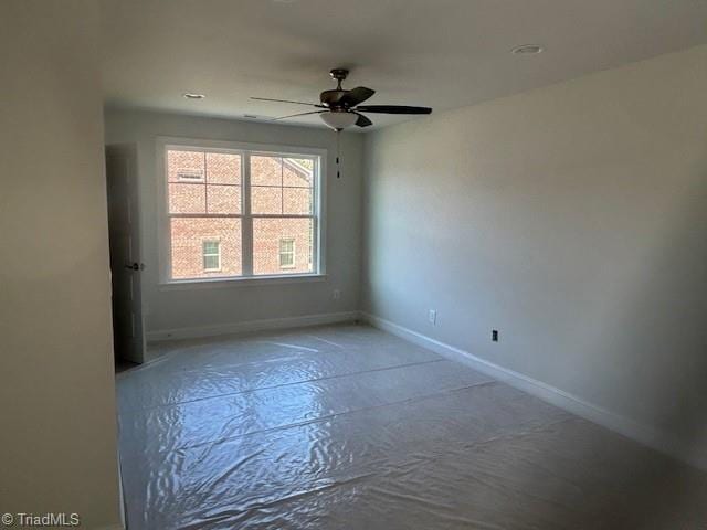 spare room featuring ceiling fan