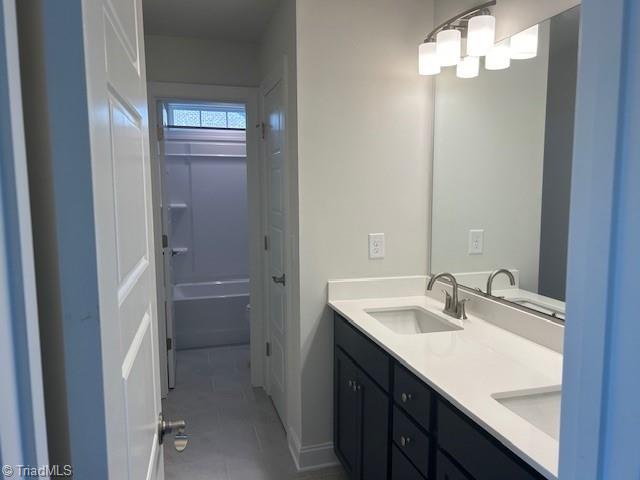 bathroom featuring tile patterned floors and vanity