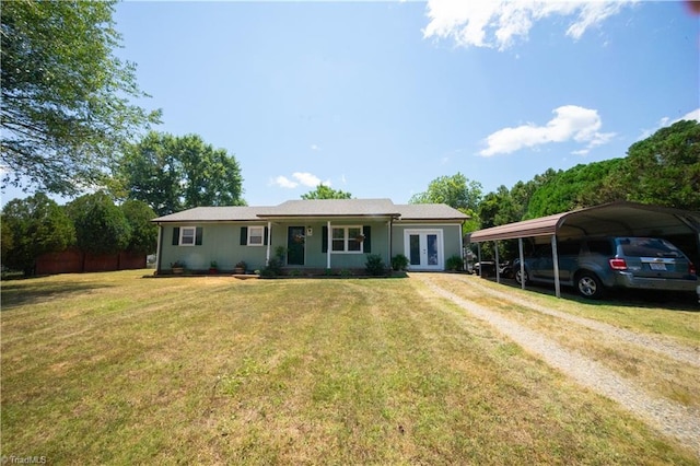 view of front of property featuring french doors, a front lawn, and a carport