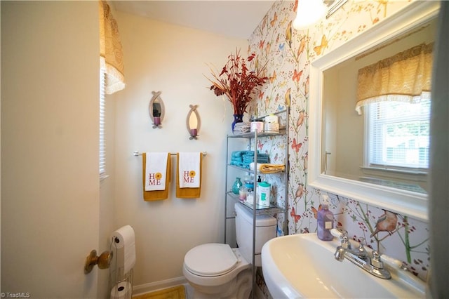 bathroom with toilet and sink