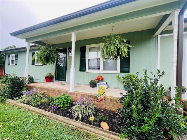 view of exterior entry featuring a porch