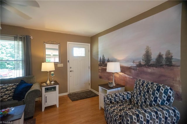 entrance foyer featuring light hardwood / wood-style flooring and ceiling fan