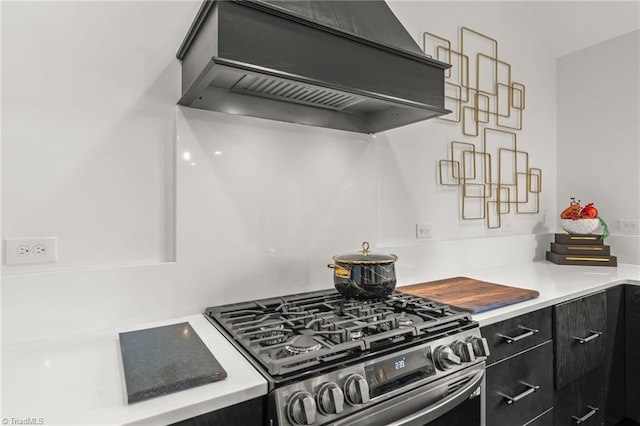 kitchen with custom range hood and gas stove