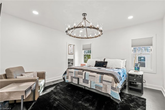 bedroom with an inviting chandelier