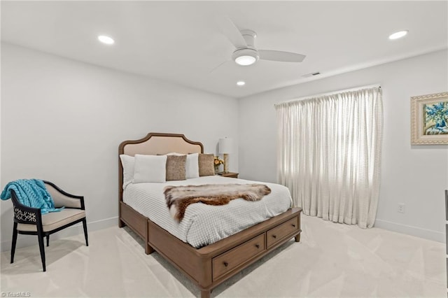 bedroom featuring ceiling fan and light carpet