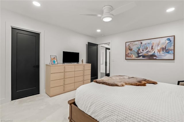 bedroom featuring ceiling fan and light colored carpet