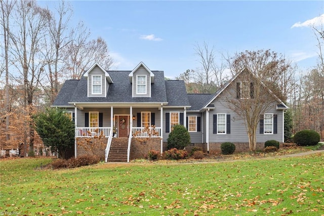 view of front of house featuring covered porch and a front lawn