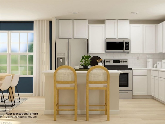 kitchen featuring electric range oven, fridge with ice dispenser, light wood-style flooring, and white cabinetry