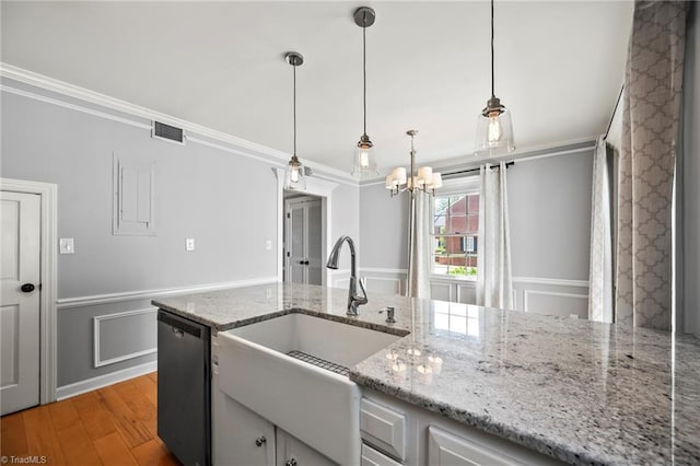 319 Hanover Arms Ct, Winston-Salem, NC 27104 - kitchen with a sink, dishwashing machine, ornamental molding, light wood finished floors, and a chandelier