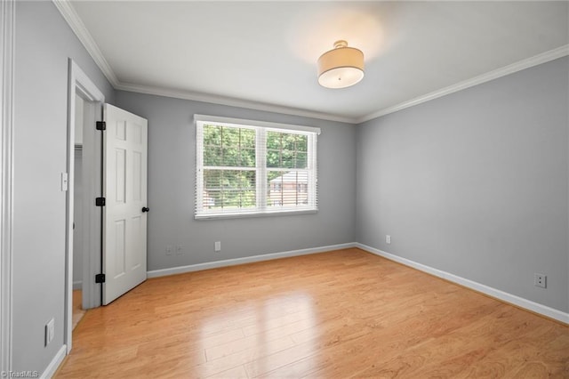 319 Hanover Arms Ct, Winston-Salem, NC 27104 - unfurnished bedroom featuring ornamental molding, light wood-style flooring, and baseboards